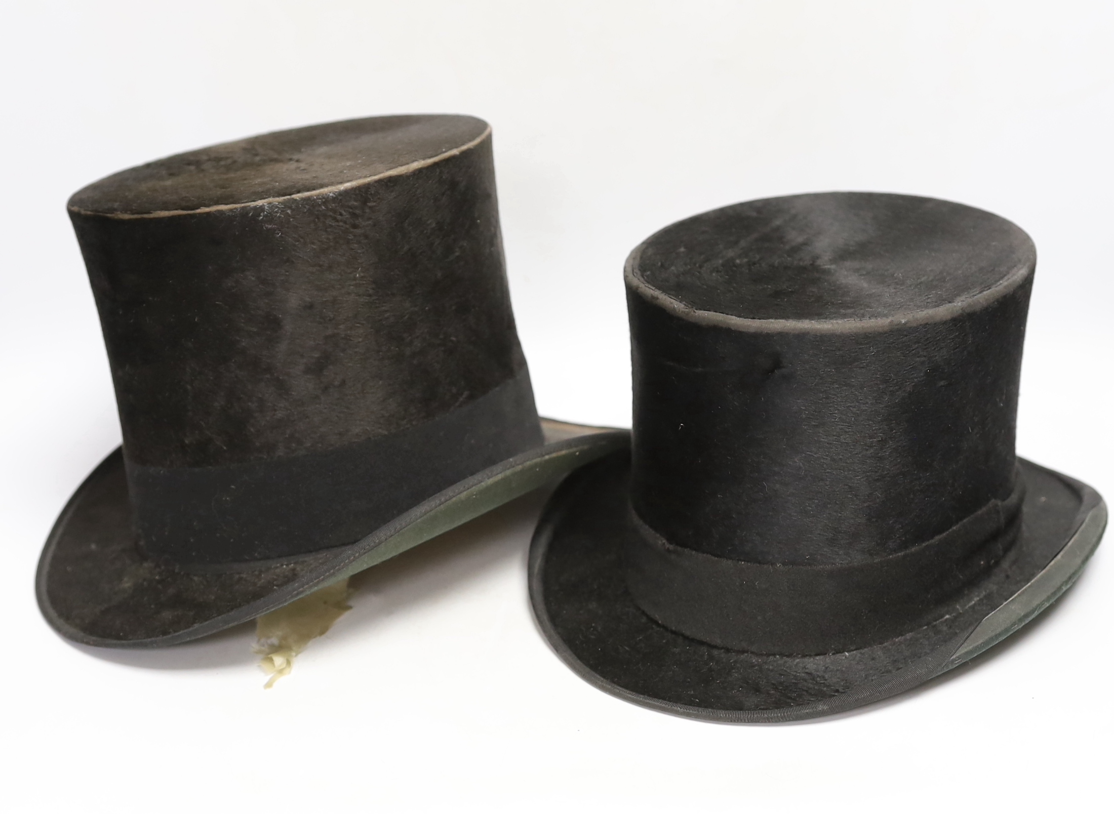 Two top hats and a straw boater